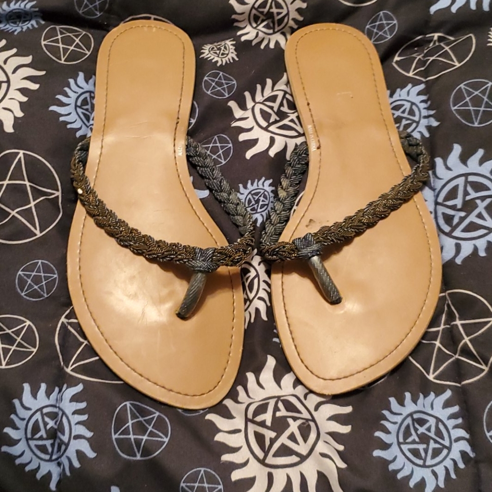 Braided black flip flops